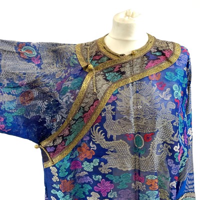 Lot 47 - A Chinese silk embroidered dragon robe, early 20th century.