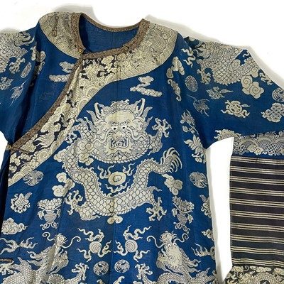 Lot 49 - A pair of Chinese silk embroidered dragon robes, early 20th century.