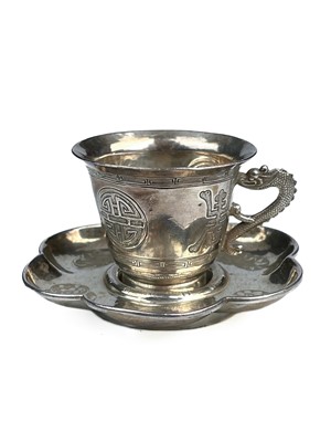 Lot 330 - A Chinese silver cup and saucer.