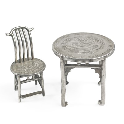 Lot 332 - A Chinese silver miniature table and chair.