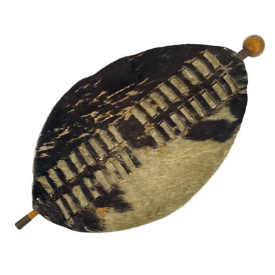 Lot 85 - An African hide shield and knobkerrie.