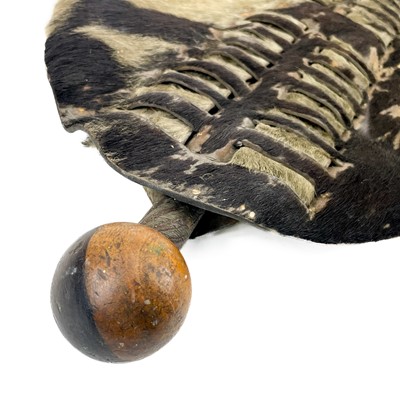 Lot 85 - An African hide shield and knobkerrie.