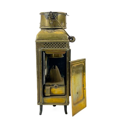 Lot 81 - A brass wardroom lamp by Eli Griffiths, 1915.