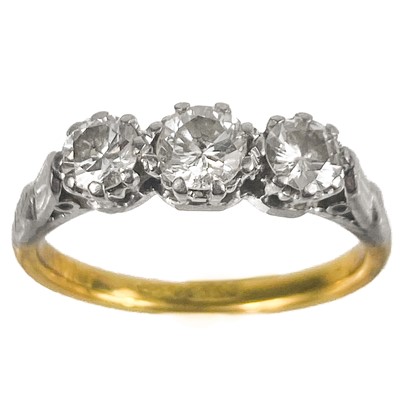 Lot 56 - An 18ct gold and platinum diamond set three stone ring.