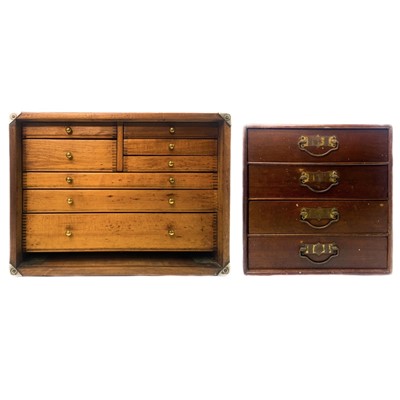 Lot 208 - An Edwardian walnut small four drawer walnut chest.