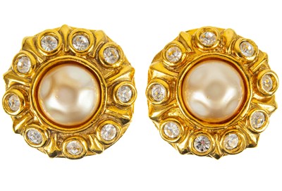 Lot 352 - A Chanel pair of 1980's faux pearl and crystal set clip earrings.