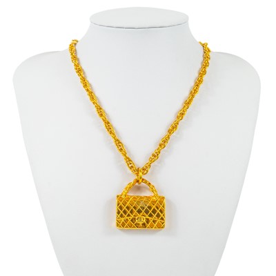 Lot 371 - A Chanel quilted handbag pendant necklace.