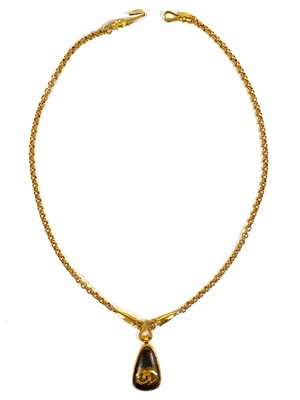 Lot 356 - A Chanel brown stone set pendant necklace.