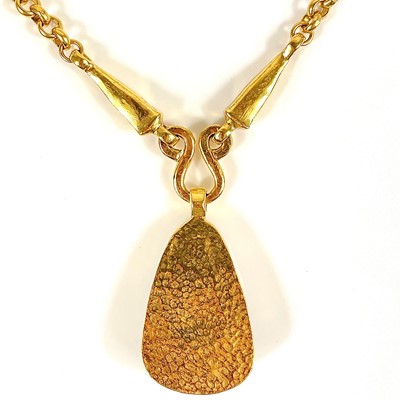Lot 356 - A Chanel brown stone set pendant necklace.