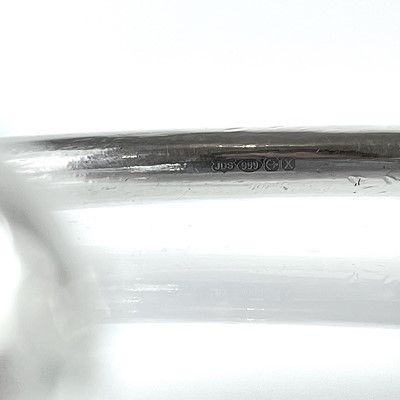 Lot 98 - A contemporary 999 fine silver torque bangle by James Suddaby.