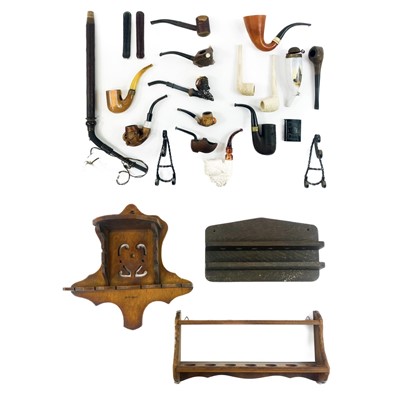 Lot 237 - A collection of pipes and three pipe racks.