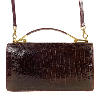 Lot 383 - A vintage brown crocodile leather handbag.