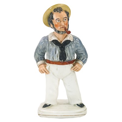 Lot 104 - A Victorian Staffordshire figure of a sailor.