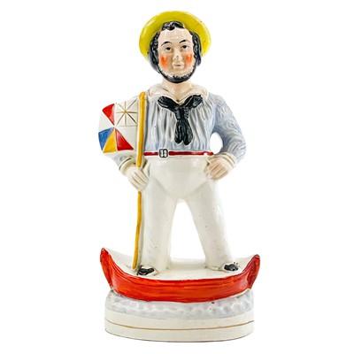 Lot 220 - A Victorian Staffordshire figure of a sailor.