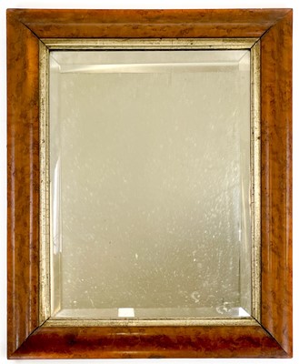 Lot 1811 - A Victorian burr walnut framed wall mirror.