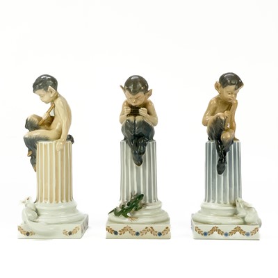 Lot 880 - Three Royal Copenhagen figures of fauns on columns