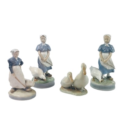 Lot 890 - A collection of four Royal Copenhagen figures of girls and geese.