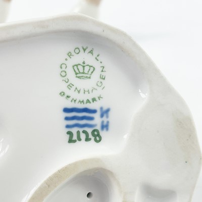 Lot 890 - A collection of four Royal Copenhagen figures of girls and geese.