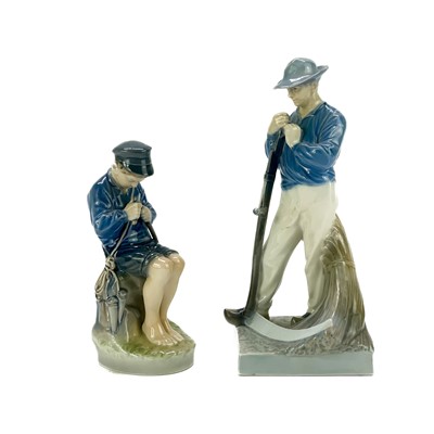 Lot 889 - A Royal Copenhagen figure of a man holding a scythe.