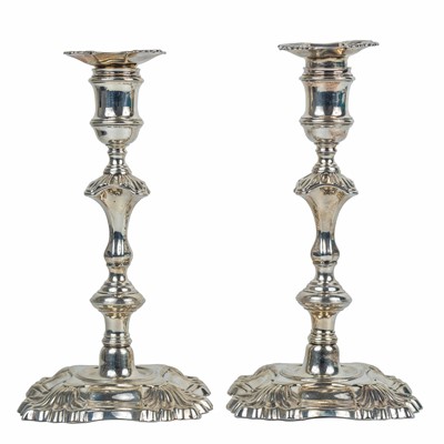 Lot 303 - A fine pair of George II silver candlesticks by Simon Jouet.