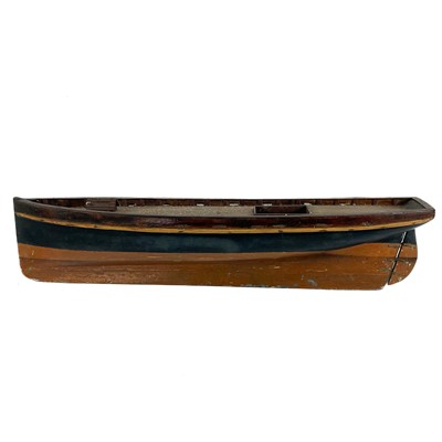 Lot 507 - An early 20th century painted wood model pond yacht with lead keel.