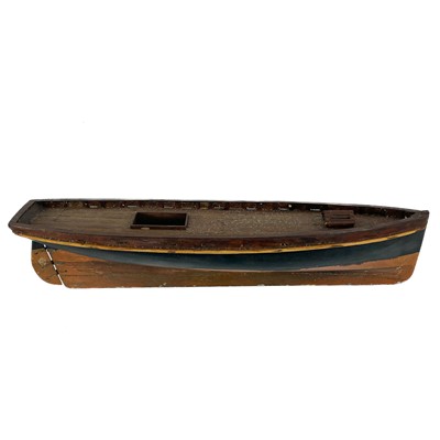 Lot 507 - An early 20th century painted wood model pond yacht with lead keel.