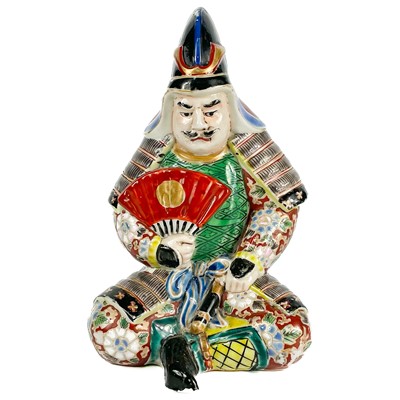 Lot 380 - A Japanese porcelain model of a samurai warrior, early 20th century.