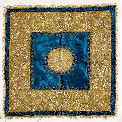 Lot 52 - An Ottoman blue velvet and gold metal thread embroidered panel, 19th century.