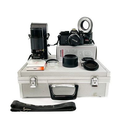 Lot 238 - A Nikon FE SLR camera black.