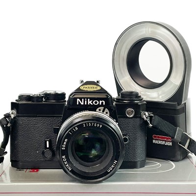 Lot 265 - A Nikon FE SLR camera black.