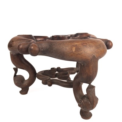 Lot 56 - An unusual Chinese carved hardwood stand, 19th century.