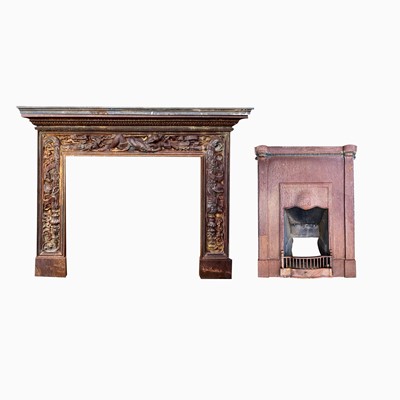 Lot 619 - A reproduction cast iron fire surround.