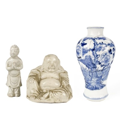 Lot 455 - A Chinese blanc de chine model of a buddha.