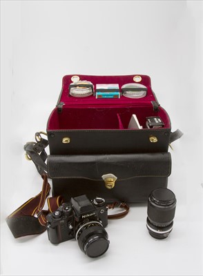 Lot 287 - A Nikon F3 SLR camera, with two lenses,...