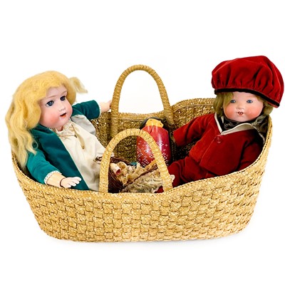 Lot 852 - Wicker Cradle Containing 4 Dolls.