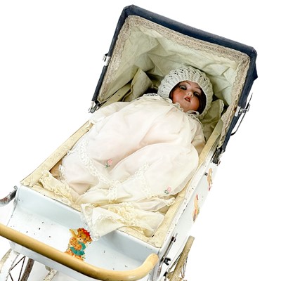 Lot 856 - German Porcelain Faced Dimpled Chin Doll in White Enamel Child's Pram.