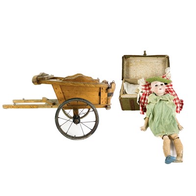 Lot 857 - A Triand miniature child's wooden cart, Armand Marseille Doll - Requiring Assembly and Clothing.