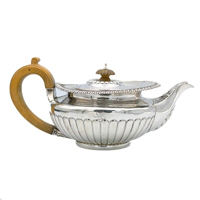 Lot 163 - A George IV silver squat half fluted teapot by Rebecca Eames and Edward Barnard.