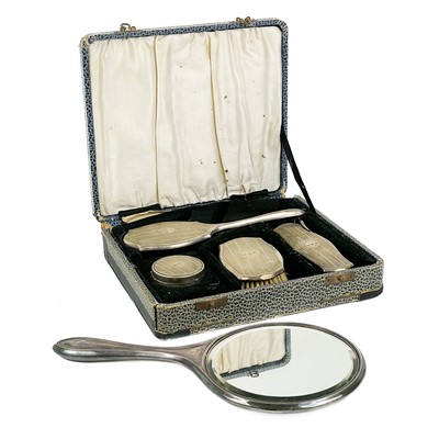 Lot 21 - A George V silver child's cased four piece dressing table set.