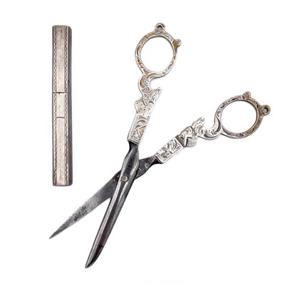 Lot 410 - A pair of 19th century Dutch silver sewing scissors and a silver needle case.