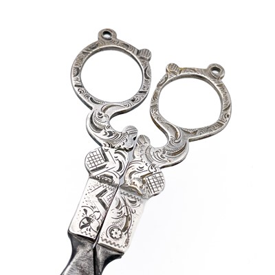 Lot 410 - A pair of 19th century Dutch silver sewing scissors and a silver needle case.