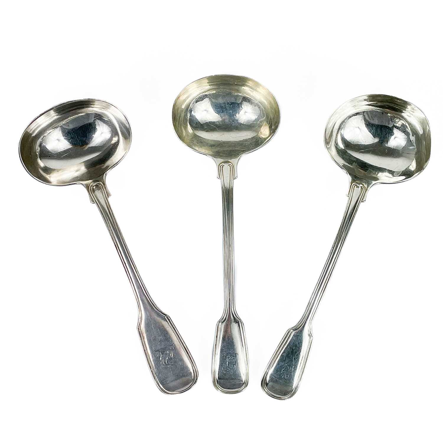 Lot 69 - Three Victorian silver sauce ladles.