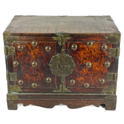 Lot 112 - A Chinese burl wood metal bound cabinet, circa 1900.