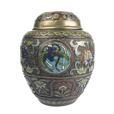 Lot 602 - A Chinese style bronze champleve enamel jar and cover.