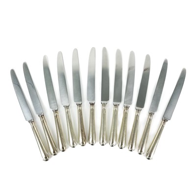 Lot 180 - A set of twelve modern silver handled dinner knives with stainless steel blades.