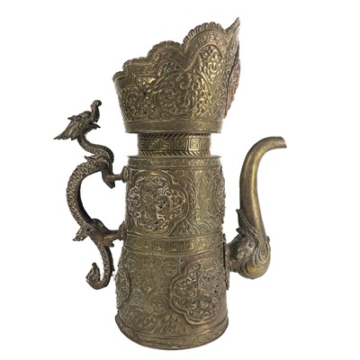 Lot 604 - A Tibetan copper and brass jug, 19th century.