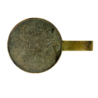 Lot 565 - A Japanese bronze hand mirror, late 19th century.