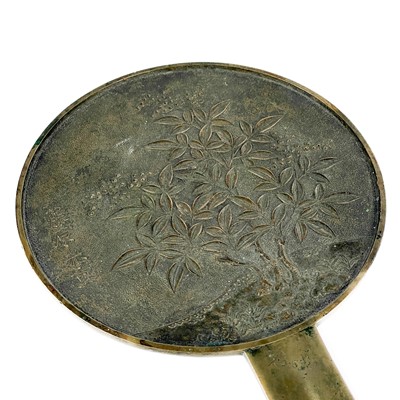 Lot 565 - A Japanese bronze hand mirror, late 19th century.