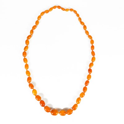 Lot 473 - A butterscotch amber oval graduated bead necklace.