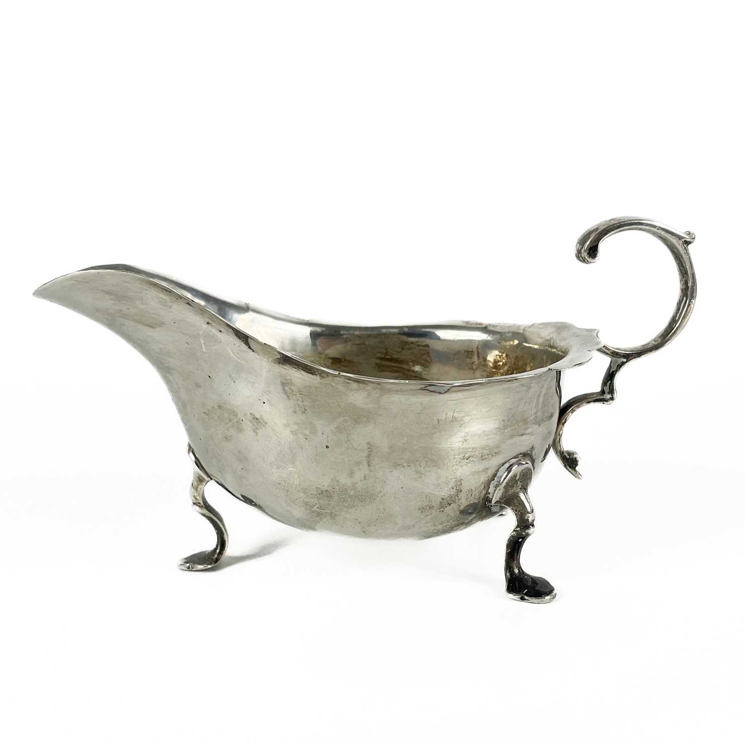 Lot 307 - A George V silver gravy boat by Martin Hall & Co Ltd.